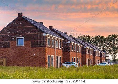 Street With Modern Family Houses In Urban Suburb In The Netherlands