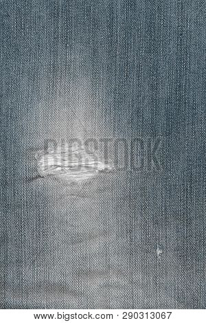 Old Jeans Background Texture ,white Stitching On Torn Denim Blue Jeans Patch. Ripped Denim Reattache