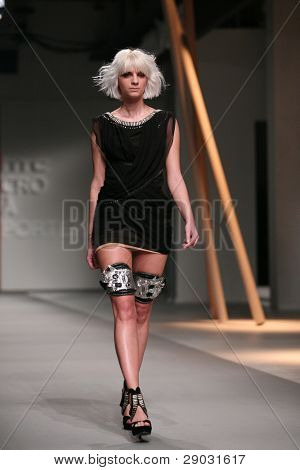 ZAGREB, CROATIA - APRIL 2: Fashion model wears clothes made by Matija Vuica in 'Croaporter' show, April 2, 2011 in Zagreb, Croatia.