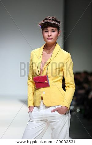 ZAGREB, CROATIA - NOVEMBER 25: Fashion model wears clothes made by Nino Bollag on 'Fashion Week Zagreb' show on November 25, 2011 in Zagreb, Croatia.