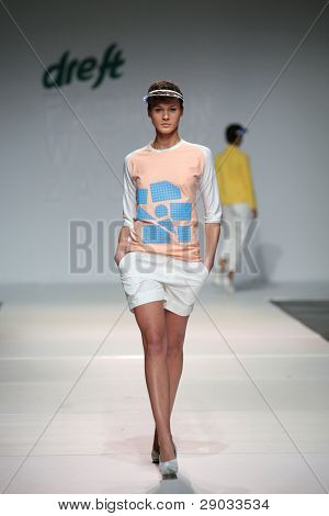 ZAGREB, CROATIA - NOVEMBER 25: Fashion model wears clothes made by Nino Bollag on 'Fashion Week Zagreb' show on November 25, 2011 in Zagreb, Croatia.