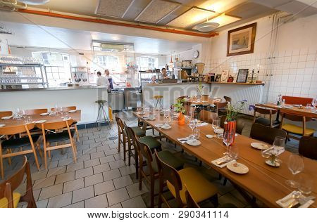 Copenhagen, Denmark - Sept 7: Emprty Room Of Small Restaurant With Open Kitchen Waiting For The Cust