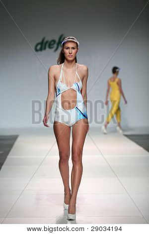 ZAGREB, CROATIA - NOVEMBER 25: Fashion model wears clothes made by Nino Bollag on 'Fashion Week Zagreb' show on November 25, 2011 in Zagreb, Croatia.