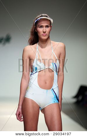 ZAGREB, CROATIA - NOVEMBER 25: Fashion model wears clothes made by Nino Bollag on 'Fashion Week Zagreb' show on November 25, 2011 in Zagreb, Croatia.