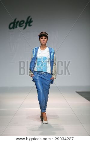 ZAGREB, CROATIA - NOVEMBER 25: Fashion model wears clothes made by Nino Bollag on 'Fashion Week Zagreb' show on November 25, 2011 in Zagreb, Croatia.