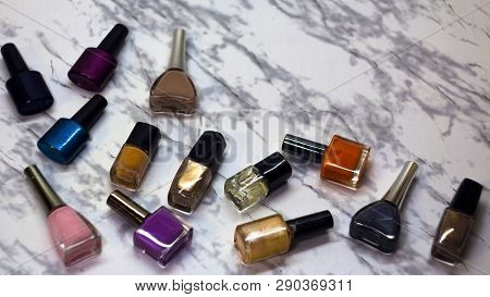 Scattered Nail Polish In The Beauty Salon. The Choice Of Color Nail Polish For Manicure Or Pedicure.