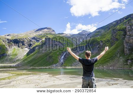 A Young Man Embracing The Nature At The Lake Called Nassfeld Speicher In Hohe Tauern National Park I