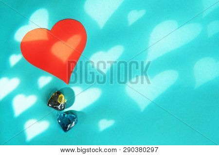 Blue Background With Red Hearts. Gobo Mask Light Effect In The Shape Of A Heart.