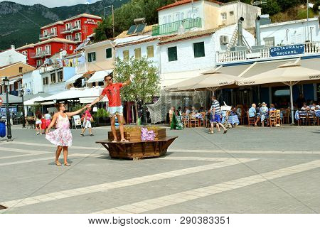 Paxos Harbour, Greece - October 01, 2017 : Paxos Harbour A Young Couple Taking A Selfie In The Town 