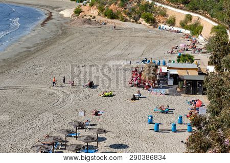 Cabo Roig, Spain - February 19, 2019: People Sunbathing Enjoy Sunny Day On Cabo Roig Sandy Beach At 