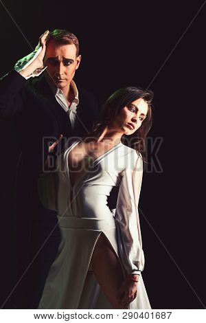A Turbulent Romance. Couple In Love With Mime Makeup. Theatre Actors Miming Through Body Motions. Mi