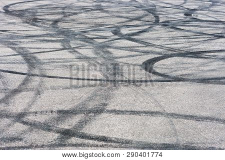 Car Track With Rubber Drift Traces. Asphalt Pavement Background Texture.