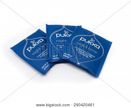 Packets Of Pukka Tea Are Displayed On A White Background