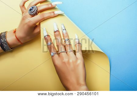 Woman Hands Holding Colorful Paper Copyspace Wearing A Lot Of Jewelry And Long Nails