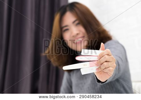 Woman Hands Holding Ovulation Test And Were Trying To Get Pregnant With Collect Urine Put The Test S
