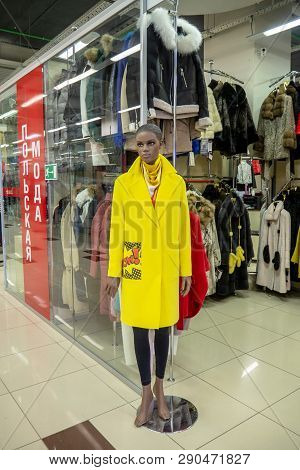 Sterlitamak, Russia - February 25, 2019: Clothing Store. Mannequin In A Yellow Coat.