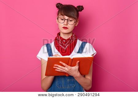 Close Up Portrait Of Young Woman, Attractive Teenager With Bunches Holds Notebook In Hands, Writes D