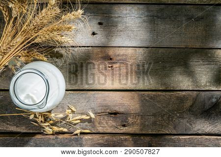 Shavout Concept - Grains, Milk And Cheese On Wood Background, Top View