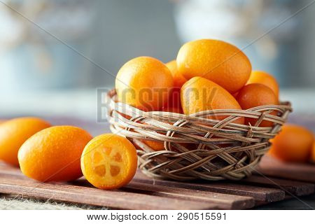 Kumquats Or Cumquats (citrus Japonica) On Wooden Background