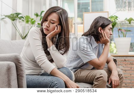 Sadness Young Asian Wife Having Quarrel And Sitting On Sofa After Fight With Husband Behind Her In H