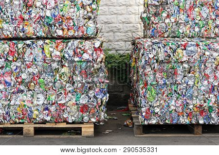 Blocks Pressed Aluminum Cans From Soft Drinks. Compacted Blocks Of Cans For Recycling At The Recycli
