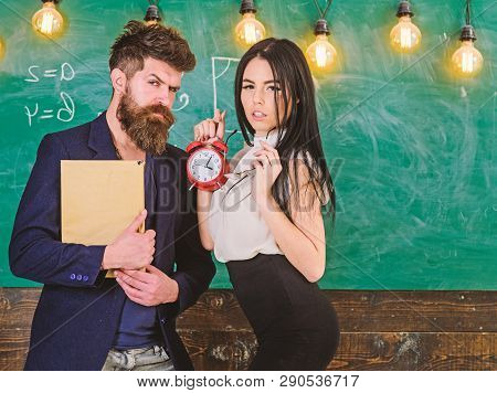 School Rules Concept. Lady Teacher And Strict Schoolmaster Care About Discipline And Rules In School
