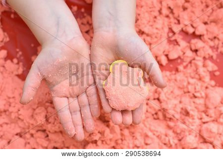 A Child Plays With Pink Kinetic Sand For Sculpting Figures And Shows His Hands With A Figure. Top Vi