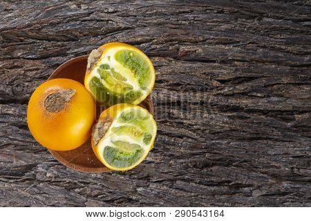 Fruit Of Lulo On Tree Bark (solanum Quitoense)