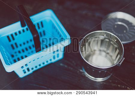 Spend Better For Less Waste Shopping Basket Next To Gargabe Bin
