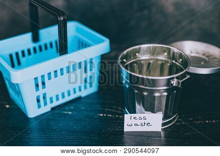 Spend Better For Less Waste Shopping Basket Next To Gargabe Bin