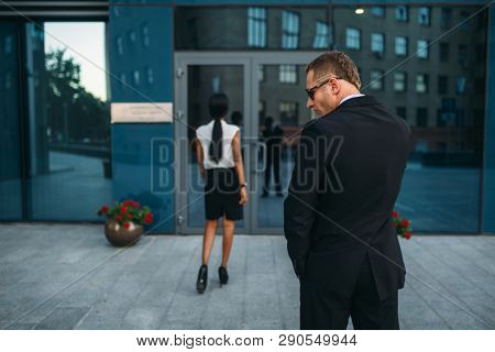 Personal guard in sunglasses and security earpiece