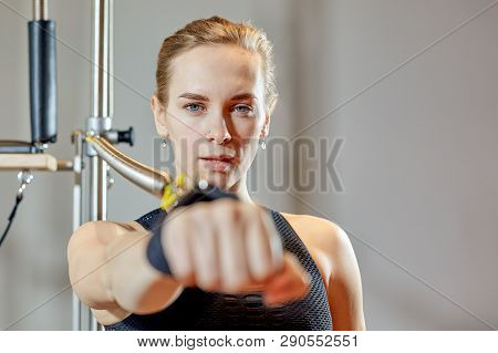 Gym Woman Pilates Stretching Sport In Reformer Bed Instructor Girl. Healthy Smiling Woman Wearing Le