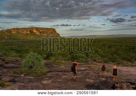Tourists Walking Down From The Nadab Lookout In Ubirr, Kakadu National Park - Australia