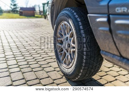 Torun, Poland - February 16, 2019. The View Of The Front, Left Wheel With Aluminum Rim, The Jeep Gra