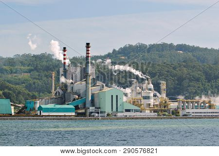 Paper Mill Factory Near A Sea Loch On Pontevedra, Spain. Pollution Concept