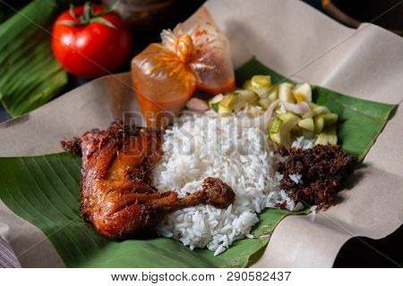 Nasi lemak kukus with chicken, popular traditional Malay local food.