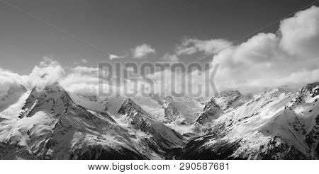 Black And White Panorama Of Sunlight Mountains In Cloud. Caucasus Mountains, Region Dombay At Winter