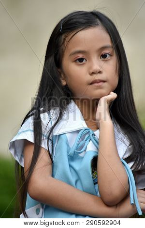 Unemotional Female Student Wearing Uniform
