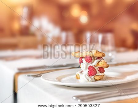 Homemade Raspberry Cake At A Restaurant Table