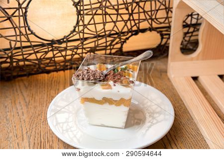 Homemade Mascarpone Mousse And Chopped Pistachios With Berries Served In White Plate.
