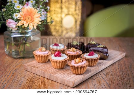Homemade Mini Cupcakes With Fresh Fruits On A Table