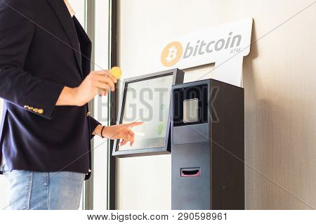 Bitcoin Atm Machine Being Used By Businessman For Buying Cryptocurrency And Other Altcoins