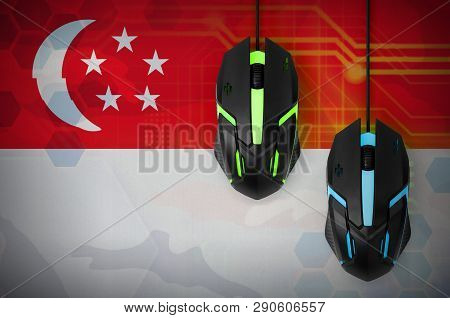 Singapore Flag  And Two Mice With Backlight. Online Cooperative Games. Cyber Sport Team