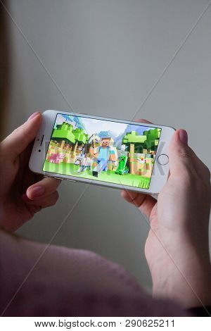 Los Angeles, California, Usa - 8 March 2019: Hands Holding A Smartphone With Minecraft Pocket Editio