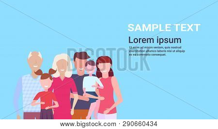 Multi-generation Family Standing Together Grandparents Parents And Children Gathering Concept Blue B