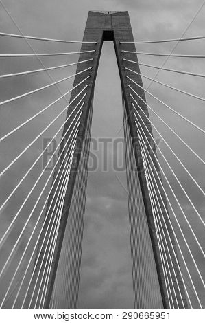 Black And White Image Of A Single Span Of A Cable Bridge On A Cloudy Day