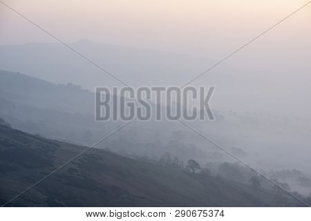 Beautiful Winter Sunrise Landscape Image Of The Great Ridge In The Peak District In England With Mis