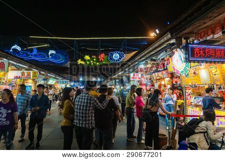 Hualien, Taiwan - March 2019: People Walking At Night Market Located In Hualien City, Taiwan. This P
