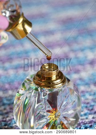 Arabian Oud Attar Perfume Or Agarwood Oil Fragrances In Glass Bottles.