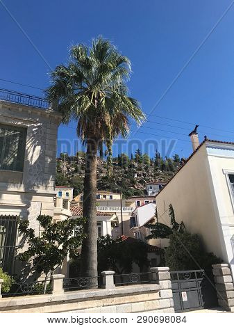 View From The Yacht To The Island With The Traditional Architecture In The Greek Style